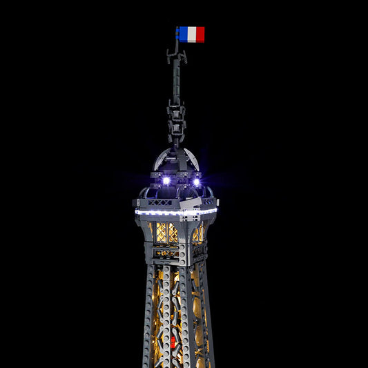 LEGO model of a tower with a flag on top, illuminated against a black background light kit for LEGO Eiffel Tower (10307)