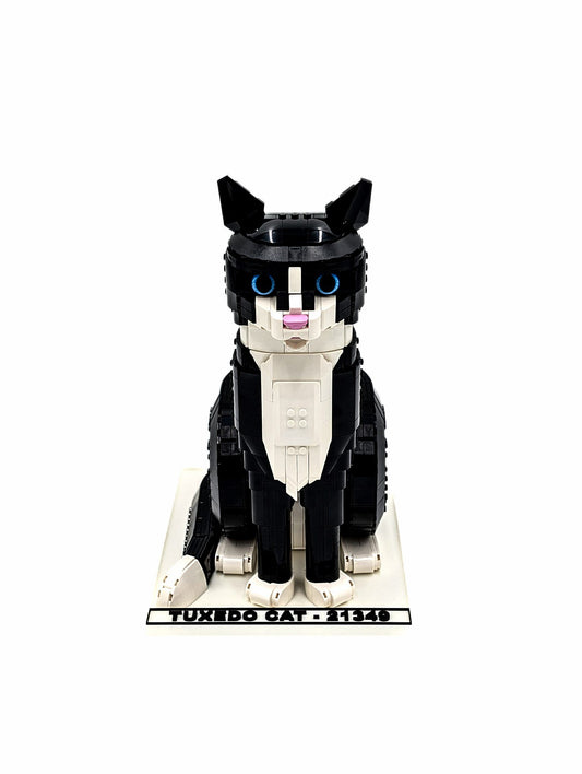 LEGO® Tuxedo Cat 21349 displayed on a white display stand, angled view