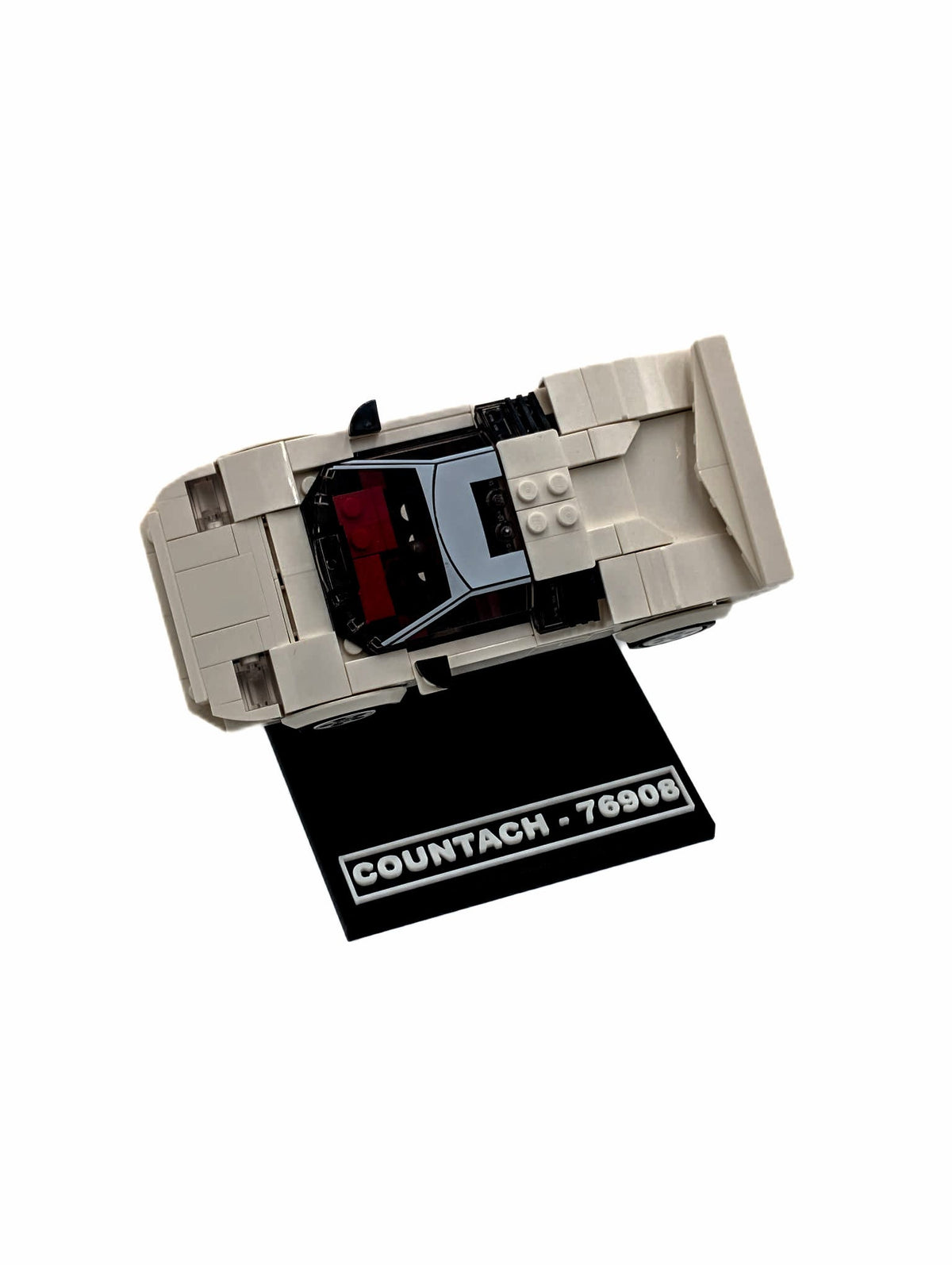 LEGO® Lamborghini Countach 76908 displayed on a black display stand, angled view