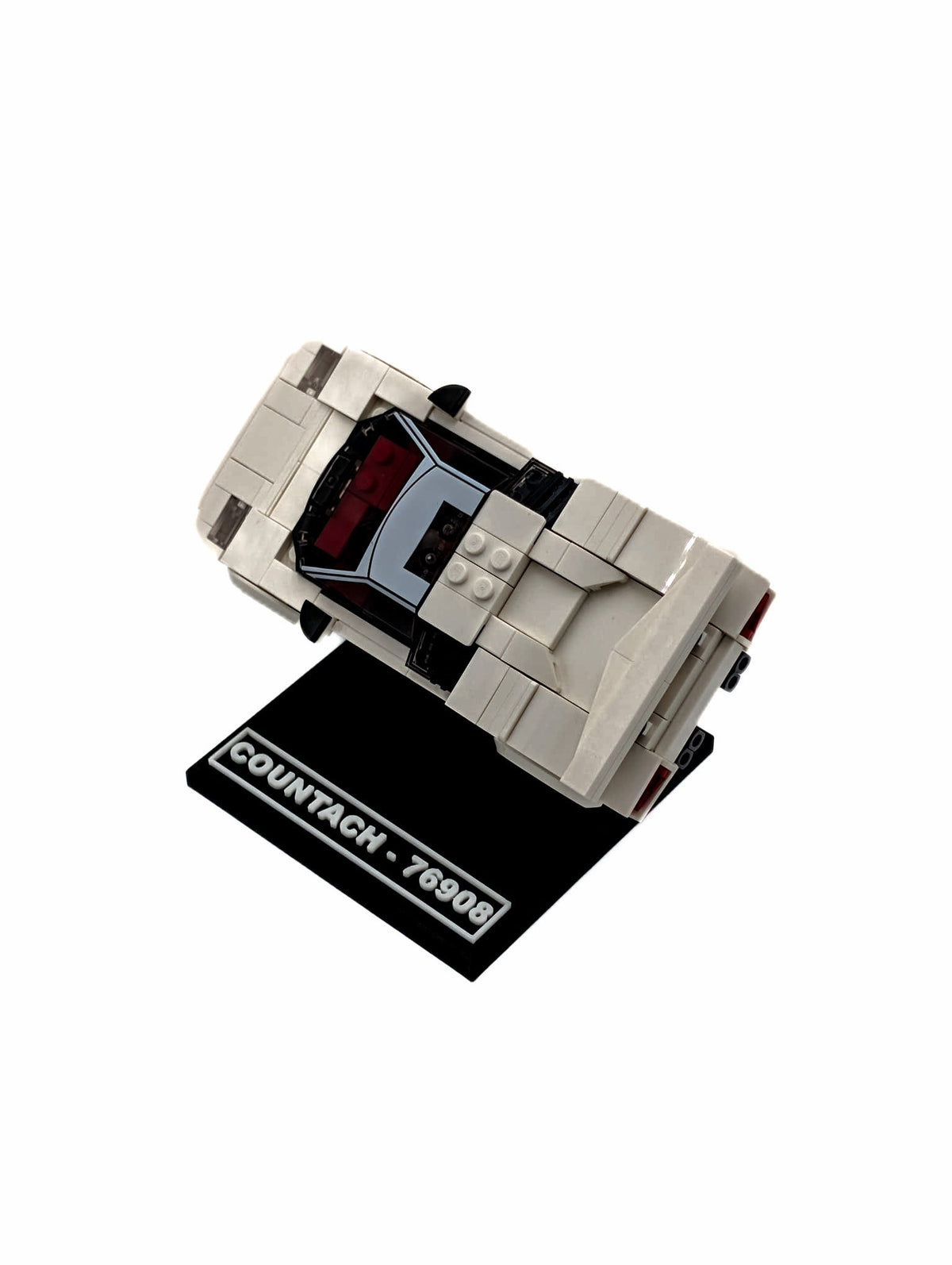 LEGO® Lamborghini Countach 76908 displayed on a black display stand, side view