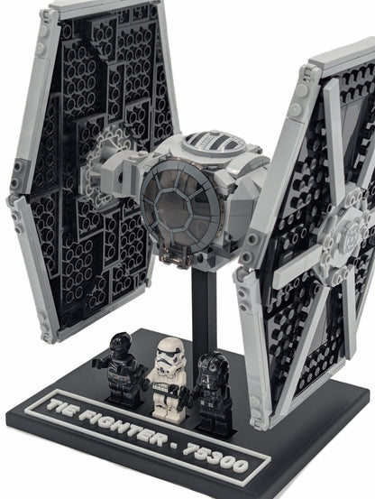 LEGO® Tie Fighter 75300 mounted on a black display stand, front three-quarter view