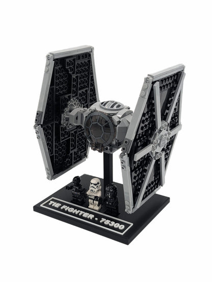LEGO® Tie Fighter 75300 mounted on a black display stand, angled front view