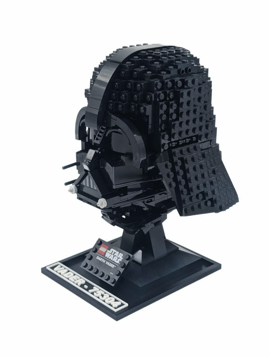 LEGO® Star Wars Darth Vader Helmet 75304 displayed on a black display stand, angled view
