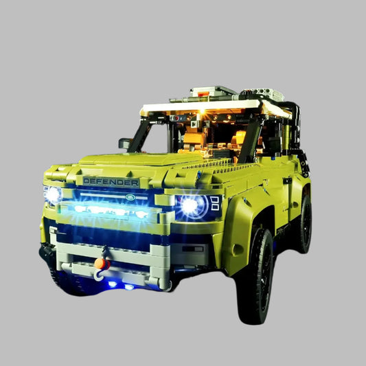 Front view of LEGO® Land Rover Defender (42110) with LED light kit – illuminating headlights and rugged design